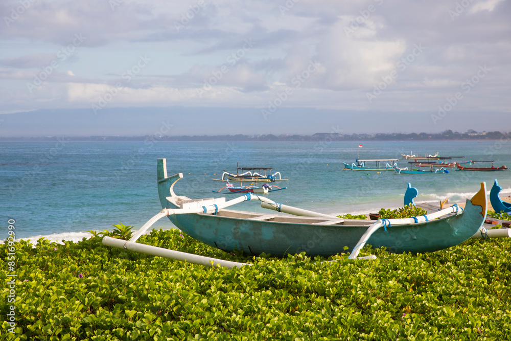 Beautiful view of the boats on Kuta beach in Bali Island, Indonesia