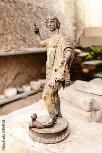 Ancient antique sculpture of a young man in the Museum of the ancient city Herculaneum photo