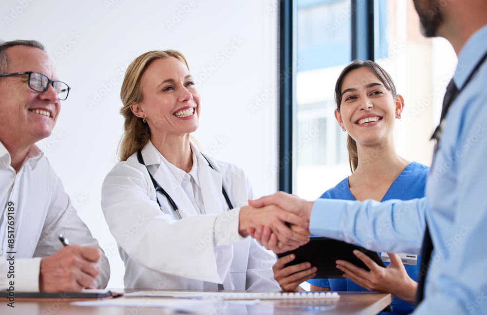 Deal, meeting and doctors in office handshake, agreement or investment in healthcare. Health insurance, men and women shaking hands with medical consultant for hospital funding, business or support Deal, meeting and doctors in office handshake, agreement or investment in healthcare. Health insurance, men and women shaking hands with medical consultant for hospital funding, business or support