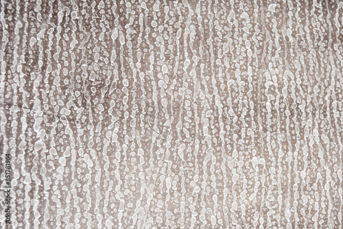 Close up detailed texture of the white limescale on the glass. Housekeeping and cleaning concept