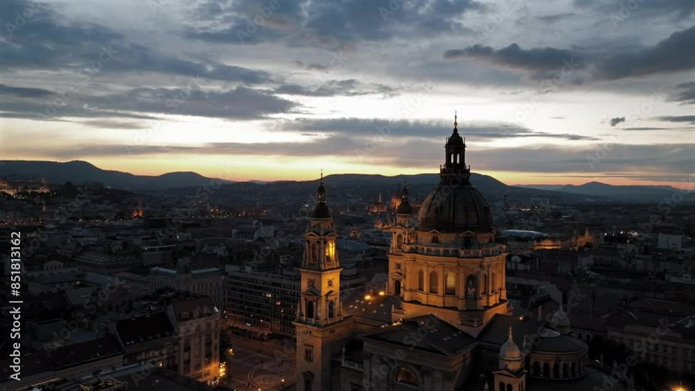 Aerial video about illuminated St Stephens basilica at dusk. Hungarian Parlament's building is on the background
Aerial video about illuminated St Stephens basilica at dusk. Hungarian Parlament's building is on the background