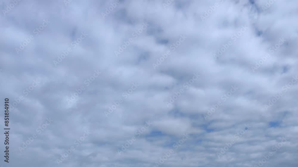 Filming of a cloudy sky full of moving cirrocumulus clouds