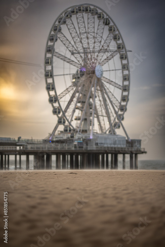 The pier and a view wheel on the beach in Hague, den Haag, Netherlands.