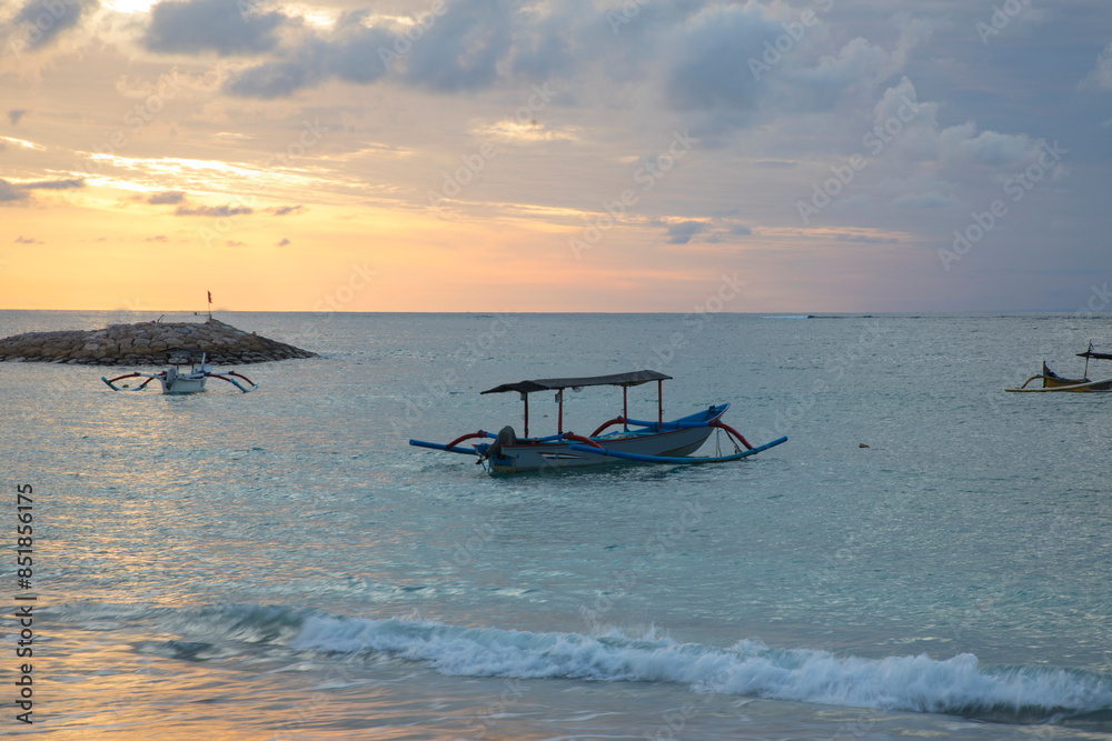 Beautiful view of the boats on Kuta beach in Bali Island, Indonesia