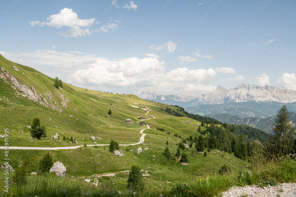 Beautiful summer view on alpine meadow with some wooden barn near the Peitlerkofel mountain. ( Sass de Putia) Idyllic scenery, Alpine meadow in the foreground, rocky Italian mountains in the backgroun Beautiful summer view on alpine meadow with some wooden barn near the Peitlerkofel mountain. ( Sass de Putia) Idyllic scenery, Alpine meadow in the foreground, rocky Italian mountains in the backgroun