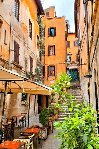 Photography Quaint restaurant in the colorful narrow lanes of historic Rome, Italy