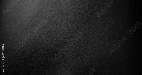 Dark texture for a gloomy background.. Black rough paper surface, slow moving. Use for background and texture. photo