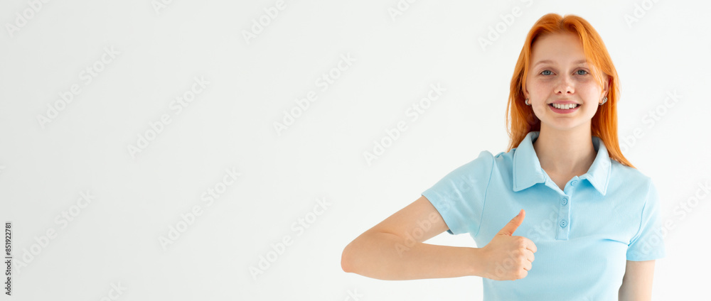 Saying yes. Smiling positive woman with orange hair, showing thumb up to like and approve, praise good thing, recommending product, white background Saying yes. Smiling positive woman with orange hair, showing thumb up to like and approve, praise good thing, recommending product, white background