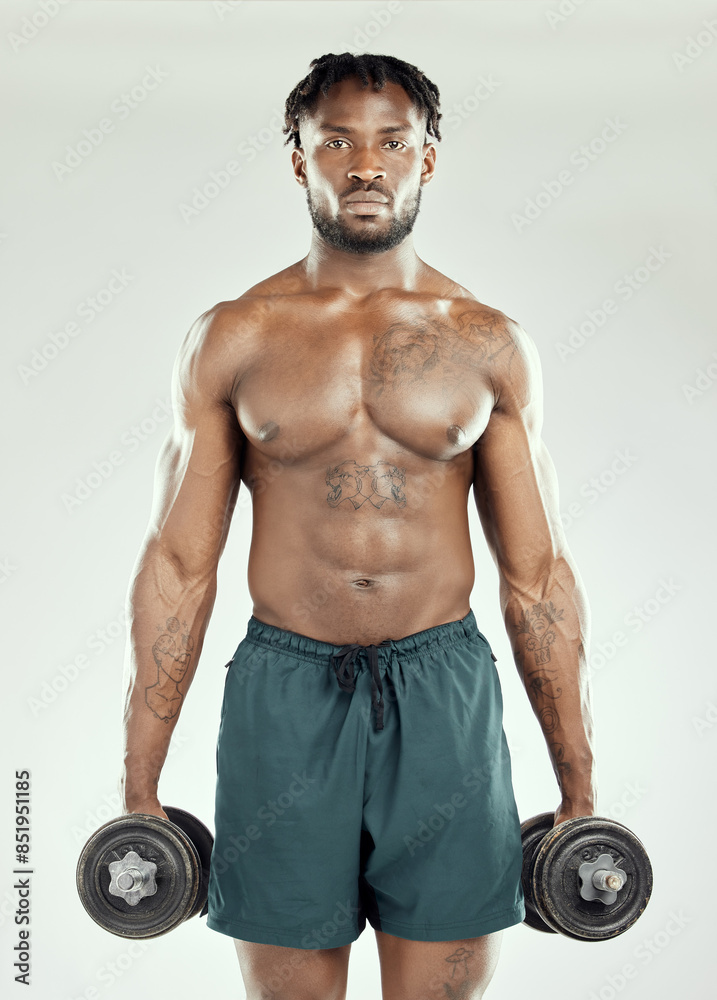 Strong, black man and weightlifting in exercise, fitness or wellness in health, muscle or training. Topless, male person and bodybuilding in sports with dumbbell, gym or endurance in white background Strong, black man and weightlifting in exercise, fitness or wellness in health, muscle or training. Topless, male person and bodybuilding in sports with dumbbell, gym or endurance in white background
