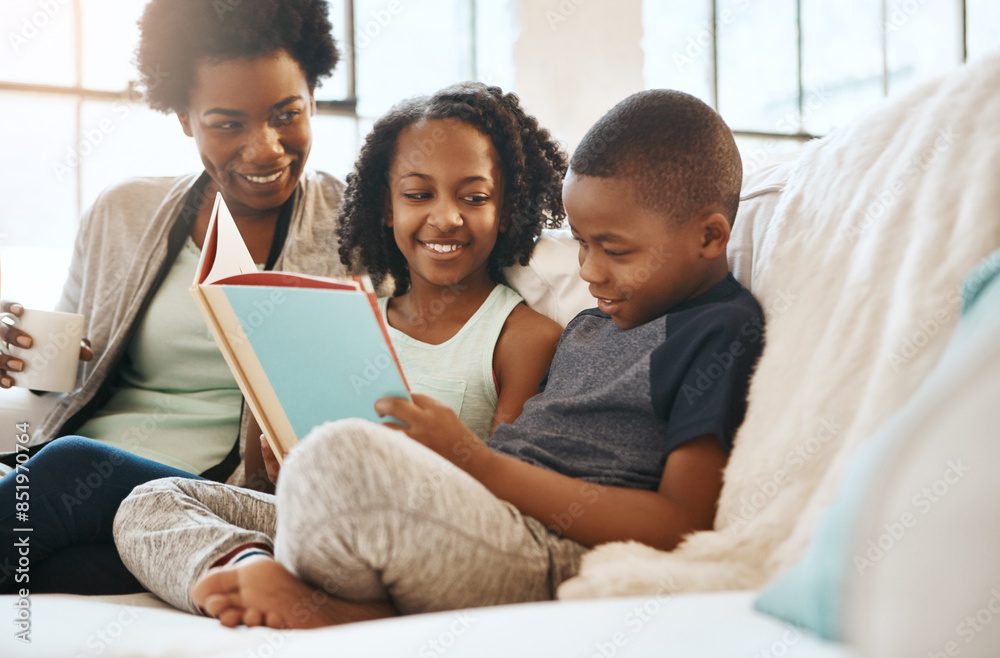 Fototapeta premium Home, storytelling and mother with kids, reading book and happiness with knowledge, learning or bonding together. Apartment, single parent on couch and mama with children or literature in living room