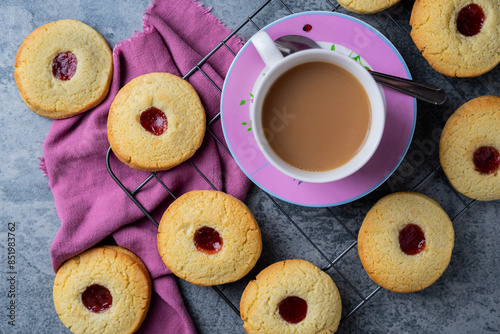 tea and jam biscuits on a cooling rack