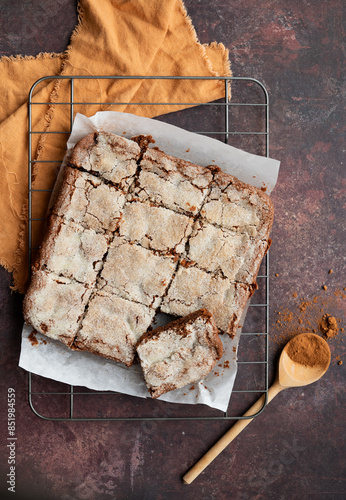 Freshly baked chocolate crunch brownies on a cooling rack