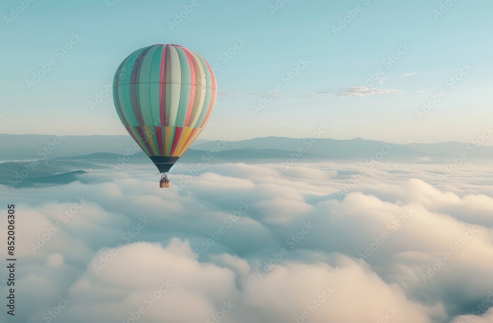 Naklejka premium Colorful hot air balloon floating above the clouds 