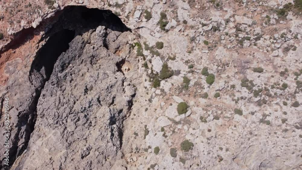 Natural windows in the rocks, Comino Island Malta, Close up revealing drone shot. High quality 4k footage Natural windows in the rocks, Comino Island Malta, Close up revealing drone shot. High quality 4k footage