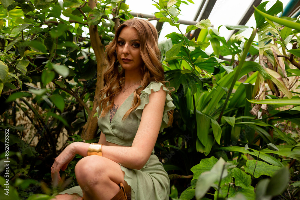 Fototapeta premium Woman who is employed at the greenhouse