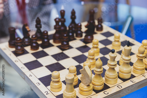 Wallpaper Mural Chess tournament, kids and adults participate in chess match game in indoor hall, players of all ages play, competition in chess school club with chessboards on a table, wooden pieces Torontodigital.ca