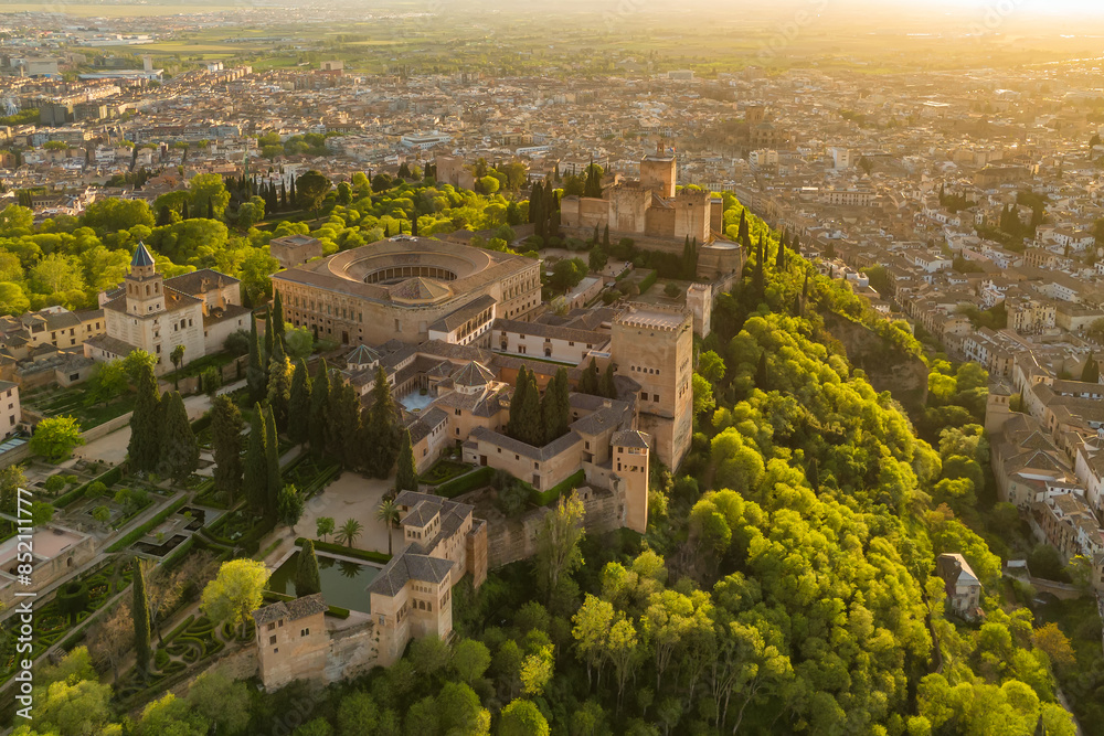 Aerial view of the Alhambra palace at sunset in Granada, Andalusia, Spain Aerial view of the Alhambra palace at sunset in Granada, Andalusia, Spain