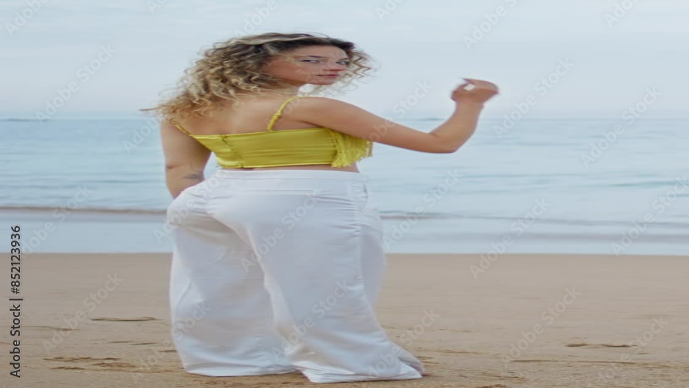 Peaceful woman enjoy ocean waves on evening beach vertical. Girl sand seashore Peaceful woman enjoy ocean waves on evening beach vertical. Girl sand seashore