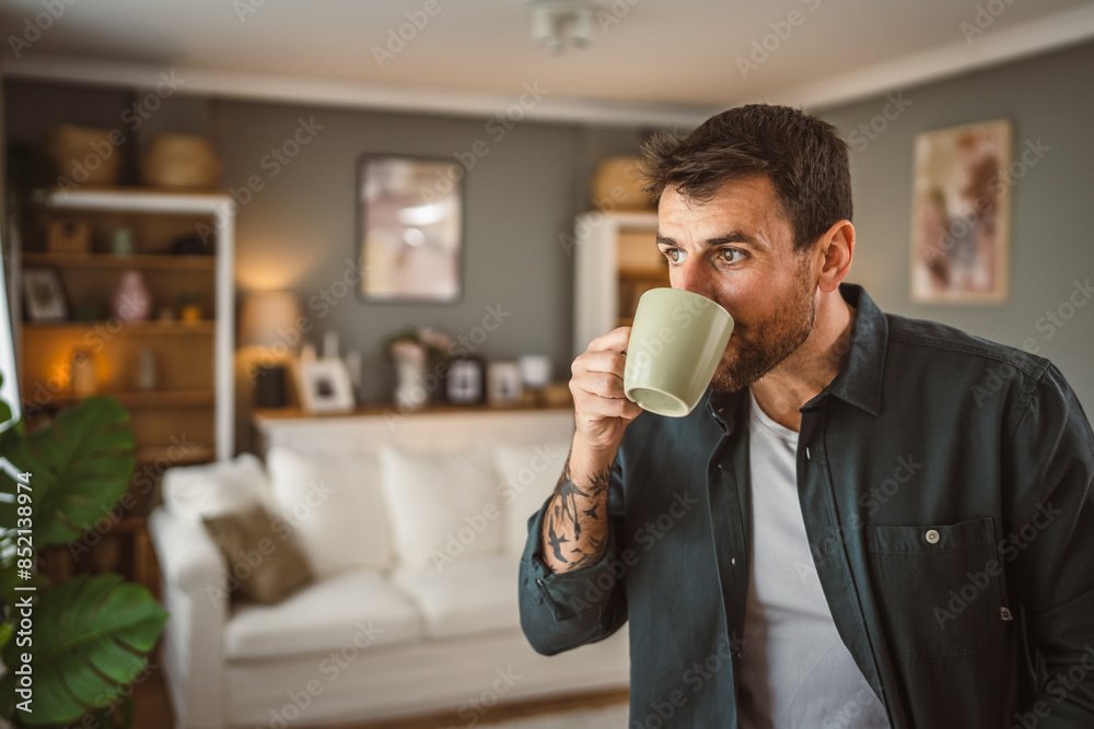 Portrait of adult handsome man drink first coffee in the living room Portrait of adult handsome man drink first coffee in the living room
