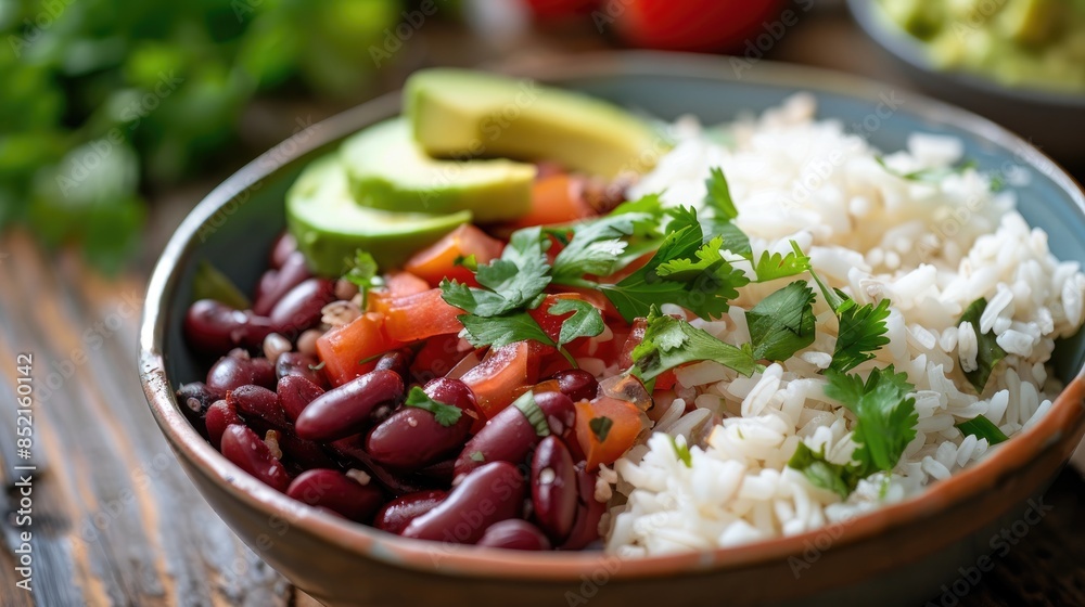 Delicious rice beans and avocado in a bowl on the table Delicious rice beans and avocado in a bowl on the table