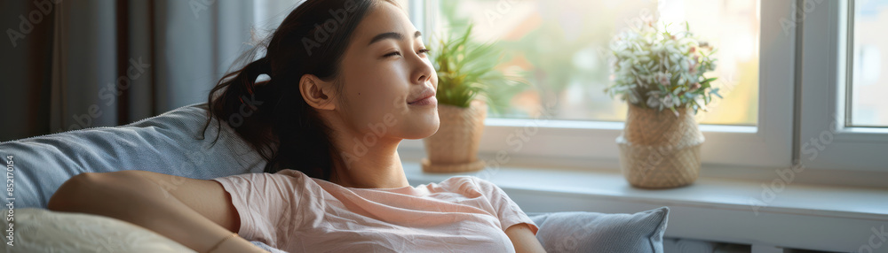 Woman Relaxing at Home by the Window Against a Sunny Backdrop, Enjoying a Peaceful Moment in a Cozy and Comfortable Space Surrounded by Green Plants and Natural Light Woman Relaxing at Home by the Window Against a Sunny Backdrop, Enjoying a Peaceful Moment in a Cozy and Comfortable Space Surrounded by Green Plants and Natural Light