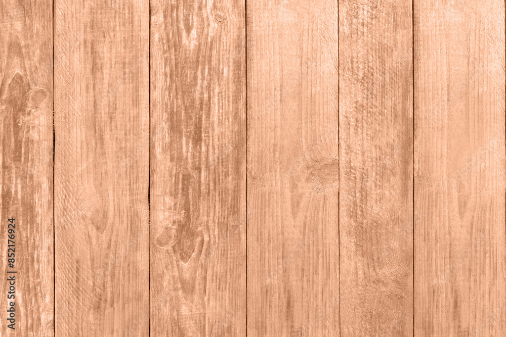 Wooden surface of peach fuzz color, top view. Trendy shade of 2024 year Wooden surface of peach fuzz color, top view. Trendy shade of 2024 year