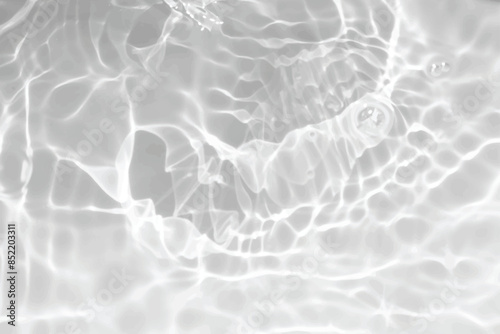 White water with ripples on the surface. Defocus blurred transparent white colored clear calm water surface texture with splashes and bubbles. Water waves with shining pattern texture background.