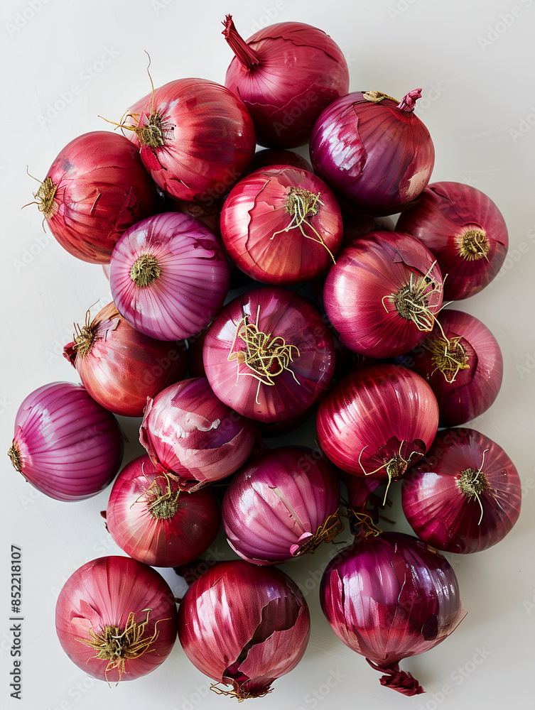 Pile of onions were heaped together. A giant pink shallot on white background Pile of onions were heaped together. A giant pink shallot on white background