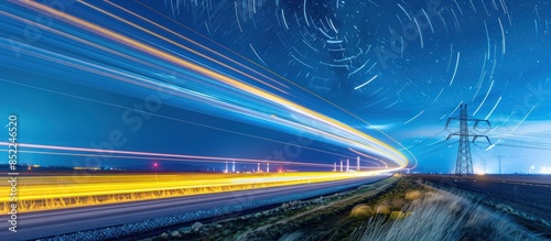 Nighttime Highway with Star Trails and Power Lines