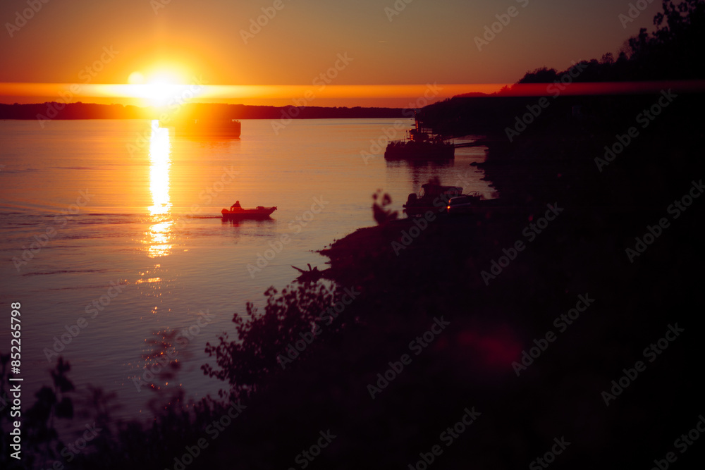 Image of a Boat Floating on Danube in the Sunset. Waterscape on a big river of a sailing boat
Image of a Boat Floating on Danube in the Sunset. Waterscape on a big river of a sailing boat