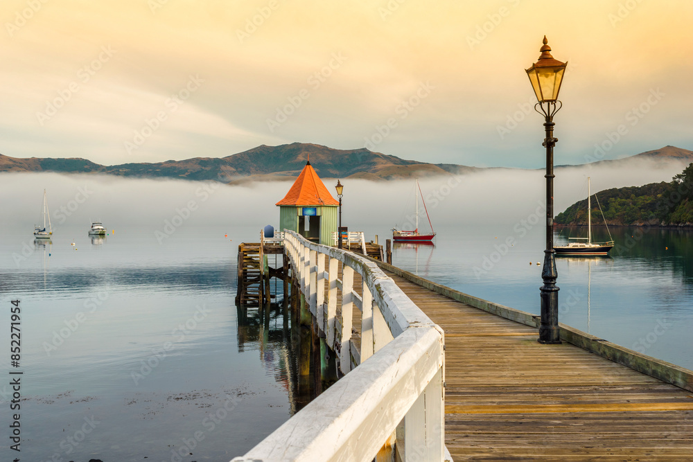Wooden Wharf at Akaroa Beach on the Banks Peninsula, southeast of Christchurch, South Island, New Zealand