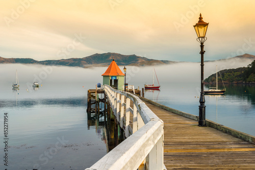 Obraz na płótnie Wooden Wharf at Akaroa Beach on the Banks Peninsula, southeast of Christchurch, South Island, New Zealand w salonie