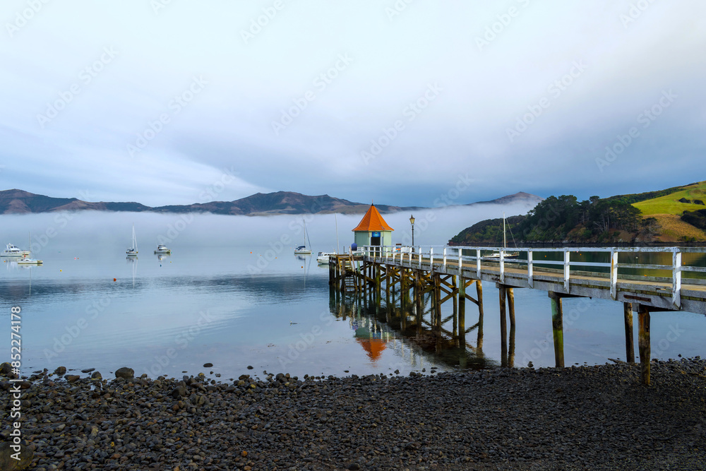 Wooden Wharf at Akaroa Beach on the Banks Peninsula, southeast of Christchurch, South Island, New Zealand