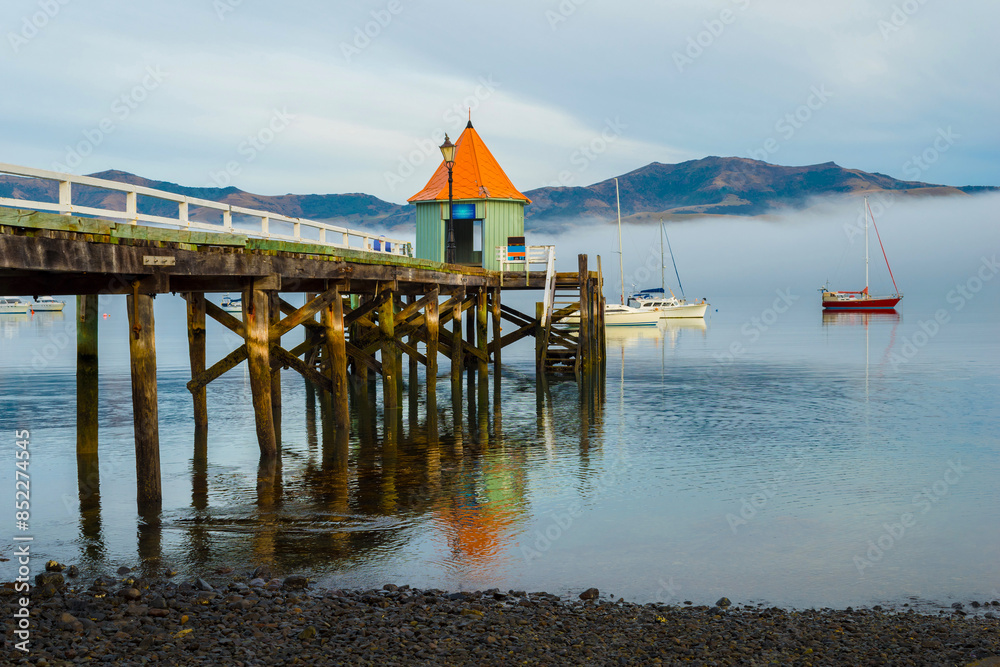 Wooden Wharf at Akaroa Beach on the Banks Peninsula, southeast of Christchurch, South Island, New Zealand