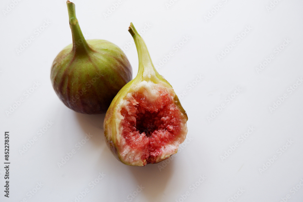 Ripe fig fruits composition on white background. Fresh fig fruits. Ripe fig fruits composition on white background. Fresh fig fruits.