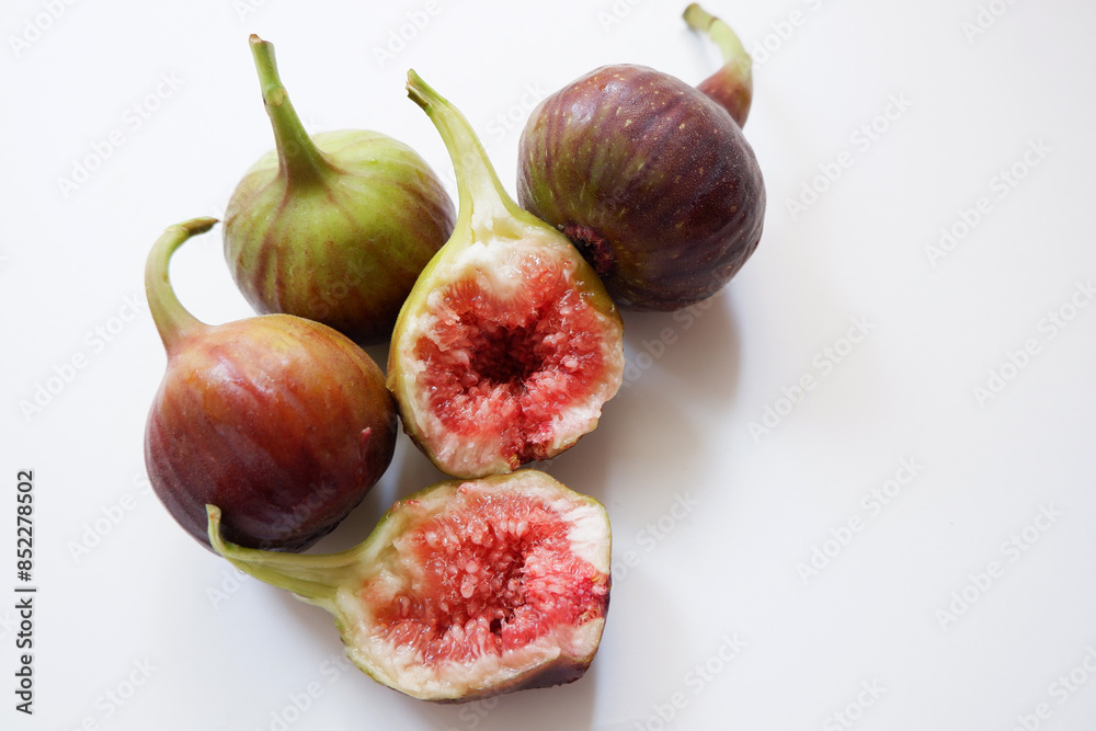 Ripe fig fruits composition on white background. Fresh fig fruits. Ripe fig fruits composition on white background. Fresh fig fruits.