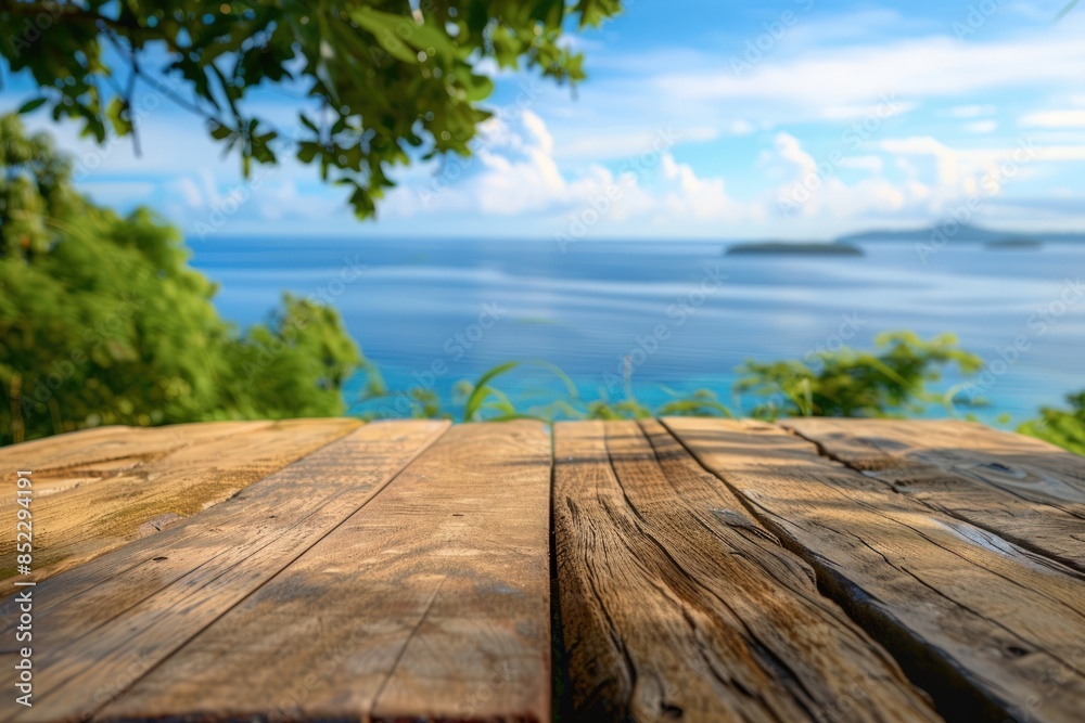 A wooden table with a view of the ocean A wooden table with a view of the ocean