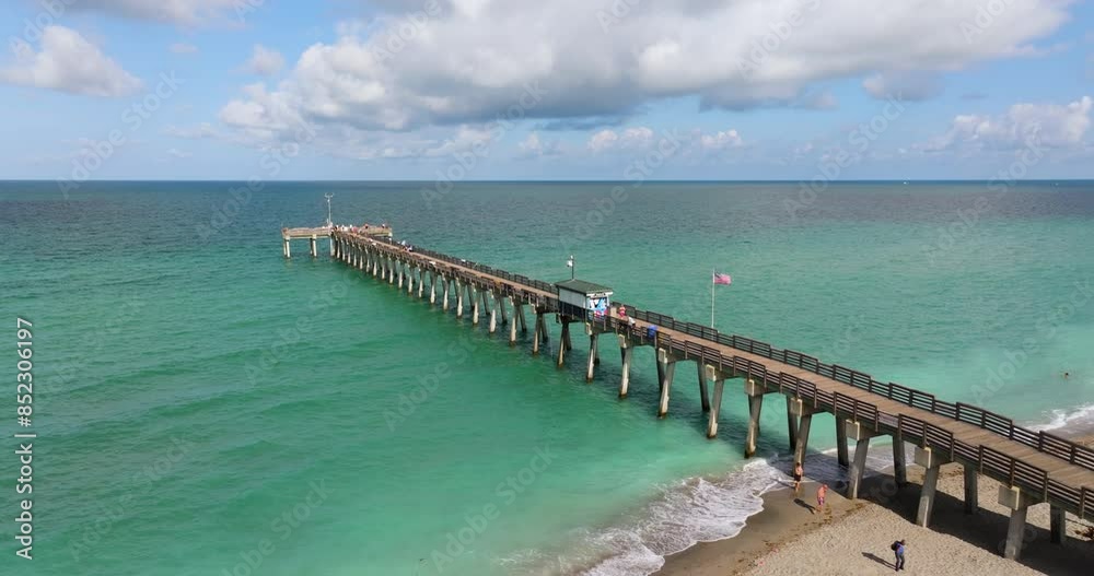 Venice, Florida. People enjoying vacation time on fishing pier. Seaside summer activities on fresh air Venice, Florida. People enjoying vacation time on fishing pier. Seaside summer activities on fresh air