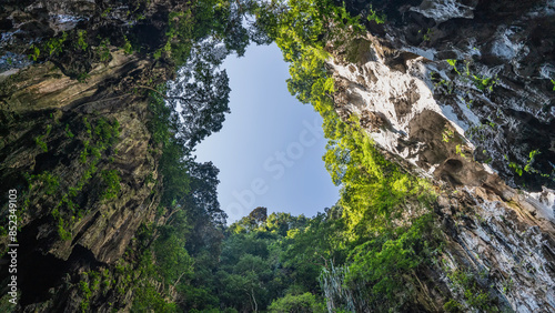 Photography The clear blue sky is framed by rocks