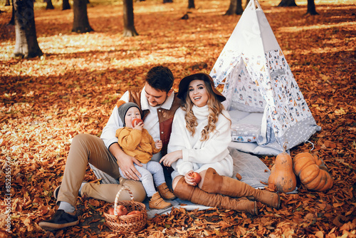 Beautiful and stylish family in a park