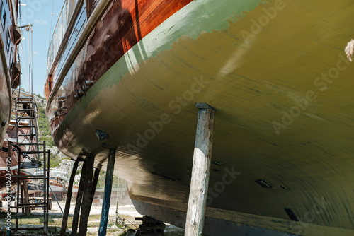 Quadro su tela wooden gulet boat hull in dry dock maitenance ready for paint, maintenance of ya