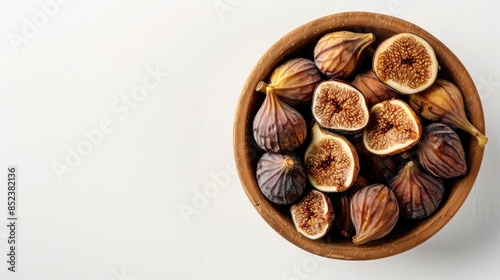 Dried figs in a wooden bowl on a white background Top view