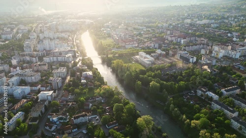 River Vrbas running through the city of Banja Luka, the capital of Republic of Srpska province, Bosnia and Herzegovina. Captivating aerial video, panoramic view. photo