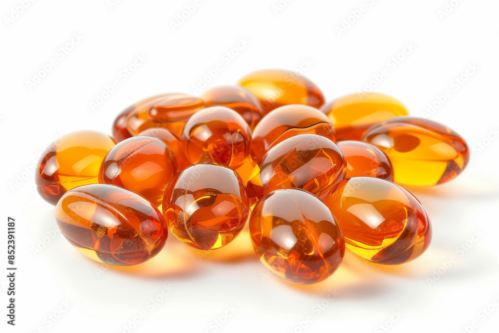 a pile of cod liver oil pills isolated on white background a pile of cod liver oil pills isolated on white background