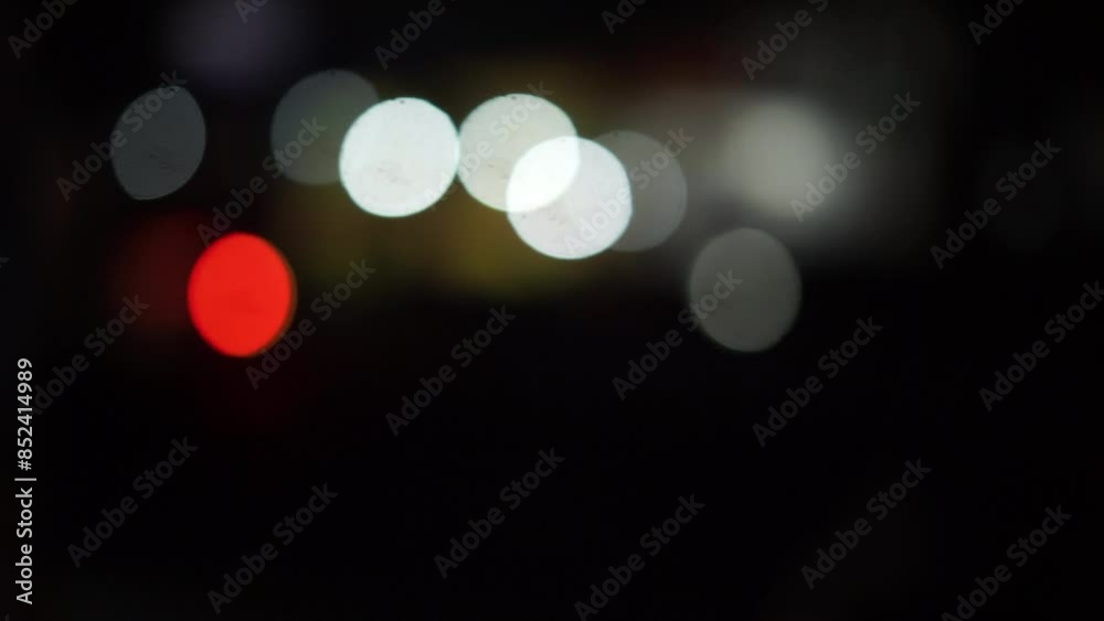 Blurred or bokeh city street scene featuring various lights from vehicles and street lamps, creating a vibrant and dreamy urban atmosphere Blurred or bokeh city street scene featuring various lights from vehicles and street lamps, creating a vibrant and dreamy urban atmosphere