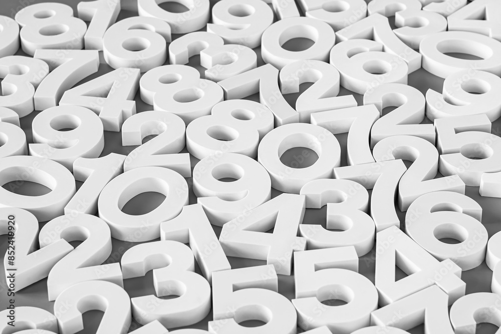 Volumetric white numbers on a neutral background. Black and white image.