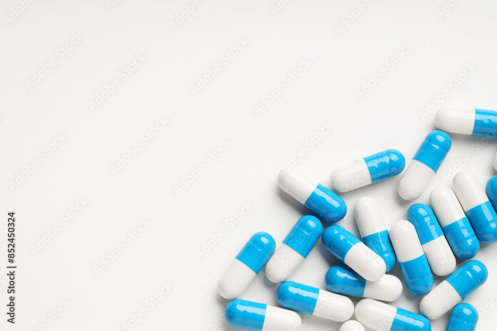 Antibiotic pills on white background, top view. Space for text Antibiotic pills on white background, top view. Space for text