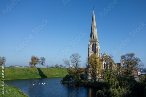 Obraz na płótnie St Alban Church (Sankt Albans Kirke) in Copenhagen, Denmark, Kastelgraven lake, swans in water w salonie