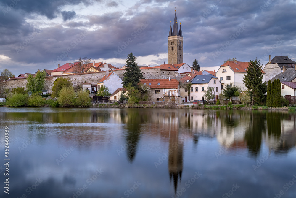 Fototapeta premium Bochemian city of Telč reflecting in the pond in the early morning, Czech Republic