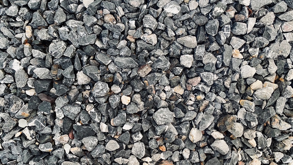 Crushed grey stone on the ground texture background, Crushed rock close up, Crushed stone road building material gravel texture, Garden gravel background stone landscaping Crushed grey stone on the ground texture background, Crushed rock close up, Crushed stone road building material gravel texture, Garden gravel background stone landscaping